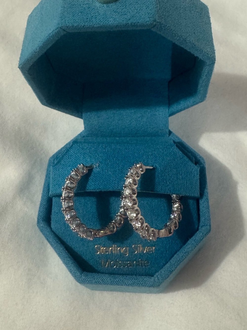 Moissanite and sterling silver hoops with lock